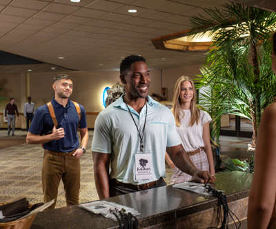 people checking in at conference